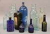 Group of twelve assorted glass bottles including Schenck's Pulmonic Syrup bottle, J. G. Godding & Co. Apothecaries Boston, Mass cobalt bottle