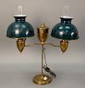 Brass double student lamp with pair of green glass shades. ht. 28in., wd. 26in.