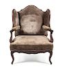 * A Louis XV Style Walnut Wingback Fauteuil Height 42 inches.