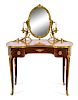 * A Louis XV Style Gilt Bronze Mounted Parquetry Dressing Table and Mirror Height overall 54 x width 41 1/2 x depth 22 inches.