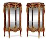 A Pair of Louis XV Style Gilt Bronze Mounted Vitrines Height 71 3/8 x width 42 1/2 x depth 17 inches.