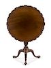 A George III Mahogany Tripod Table Height 28 1/2 x diameter of top 30 inches.