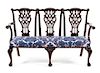 A Chippendale Style Mahogany Triple Back Settee Height 38 1/2 x width 62 inches x depth 21 1/2 inches.