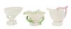 * Three Belleek Shell Form Vases Height of tallest 5 1/4 inches.