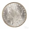 Silver Morgan dollar coin, 1898 O, MS-64 to MS-65.