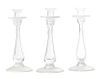 A Set of Three Glass Candlesticks, Height 12 3/8 inches.