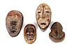 Four African Carved Wood Masks Height of largest 10 inches