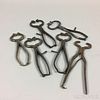 Six Pairs of Wrought Iron Sugar Nippers.  Estimate $200-300