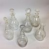 Six Blown Colorless Glass Decanters
