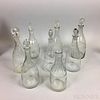 Eight Etched and Blown Colorless Glass Decanters