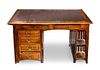 An Arts & Crafts Style Mahogany Desk, Height 29 1/2 x width 47 1/4 x depth 27 1/2 inches.