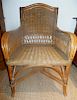 A Wicker Armchair. Height 36 x width 24 x depth 19 1/2 inches.