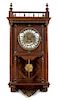 A French Walnut Wall Clock Height 35 1/2 inches.