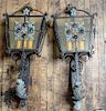 * A Pair of Wrought Metal and Glass Lanterns Height 34 inches.