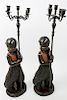 * A Pair of Cast Metal Figural Candelabra Height overall 31 inches.