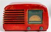 A Red Catalin Stuart Warner Radio. Model no. C51T2 Width 13 1/4 inches
