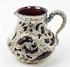 * An American Silver Mounted Glass Water Pitcher, Whiting Mfg. Co., New York, NY, the silver liner worked with openwork floral,