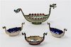 A Group of Four Swedish Silver Salts, 20th Century, each in the form of a Viking ship, comprising a champleve enamel example, on