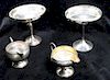 A Collection of Weighted Silver Table Articles, various makers, comprising candlesticks, tazze, creamers, vases, casters and bow
