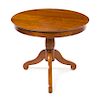 * A French Carved Wood Occasional Table Height 28 1/4 x diameter 33 1/2 inches.