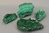 Group of four large malachite polished stone pieces. wd. 5in. to 8in.