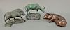 Three bronze pieces to include bronze pig laying down (lg. 10in.), bronze bear (ht. 6 1/2in., lg. 9in.), and a bronze buffalo on a s...