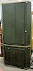 Primitive American two part cupboard in old green paint, circa 1800 (waist molding missing, most of top molding available). ht. 87in...