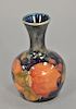 Moorcroft English pottery bud vase with original paper label on the bottom. ht. 3 3/4in.