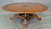Contemporary round inlaid top table on center pedestal base. ht. 29in., dia. 84in.