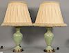 Group of ten lamps including eight table lamps, a pair of porcelain, lucite lamp, etc, along with a leather and brass floor lamp. 14...