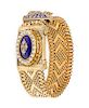 * A 14 Karat Yellow Gold, Diamond, Cultured Pearl and Enamel Belt Bracelet Surprise Wristwatch, 42.30 dwts.