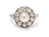 An Edwardian Platinum, Pearl and Diamond Ring, 3.20 dwts.