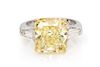 A Platinum, 18 Karat Yellow Gold, Fancy Yellow Diamond and Diamond Ring, 5.90 dwts.