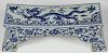 A CHINESE BLUE AND WHITE PORCELAIN DRAGON PILLOW