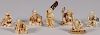 SEVEN CARVED IVORY FIGURAL NETSUKES