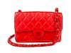 A Chanel Red Lambskin Quilted Flap Bag, 10" x 7" x 2.75"; Strap drop: 19".