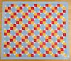 Pieced cross and block quilt