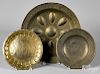 Three embossed brass plates/chargers