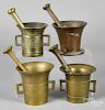 Four brass and base metal mortar and pestles