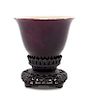 * A Chinese Aubergine Glazed Porcelain Cup Height 2 1/2 inches.