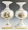 Pair of Meissen Style Baluster Vases, late 19h c., with applied relief floral decoration around a floral reserve on one side and a reserve of lovers i
