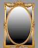 Louis XV Style Gilt and Gesso Overmantle Mirror, 20th c., with a floral shield crest above two floral garlands over a central oval wide beveled plate,