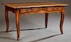 French Provincial Louis XV Style Carved Walnut Writing Table, 19th c., the rectangular rounded corner and edge plank top, over a serpentine skirt with