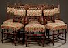 Set of Eight French Henri II Style Carved Walnut Dining Chairs, c. 1880, the pierced crests above upholstered splats and spindled arches above an upho