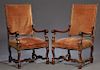 Pair of French Louis XIII Style Carved Mahogany Fauteuils a la Reine, early 20th c., the rectangular bands over acanthus carved scrolled arms on cabri