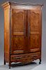 French Provincial Carved Walnut Louis XV Style Armoire, 19th c., the stepped rounded corner crown over double burled walnut panel doors with long stee