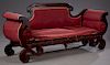 American Empire Revival Carved Mahogany Sofa, late 19th c. the upholstered back with a carved arched scrolled crest rail over cornucopia arms with bol