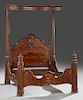 American Rococo Carved Mahogany Half Tester Bed, c. 1850-1860, stamped "C. Lee, 2776," the shaped beaded tester on tapered cluster column posts, flank