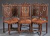 Set of Six French Carved Oak Gothic Style Dining Chairs, 19th c., the arched pierced crest flanked by fleur-de-lis finials, over a rosette carved back