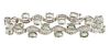 18K White Gold Link Bracelet, the eighteen curved links mounted with five round diamonds, each with a natural green app. one carat oval sapphire atop 
